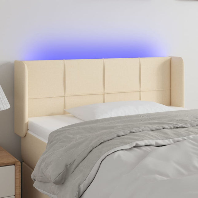 sengegavl med LED-lys 83x16x78/88 cm stof cremefarvet