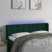 sengegavl med LED-lys 147x16x78/88 cm fløjl mørkegrøn