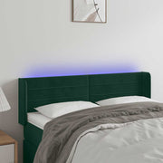 sengegavl med LED-lys 147x16x78/88 cm fløjl mørkegrøn