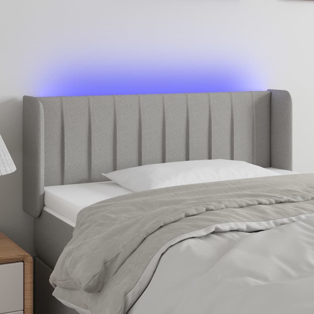 sengegavl med LED-lys 83x16x78/88 cm stof lysegrå