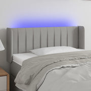 sengegavl med LED-lys 83x16x78/88 cm stof lysegrå