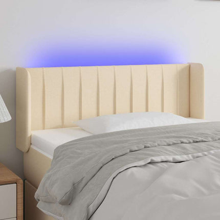 sengegavl med LED-lys 93x16x78/88 cm stof cremefarvet