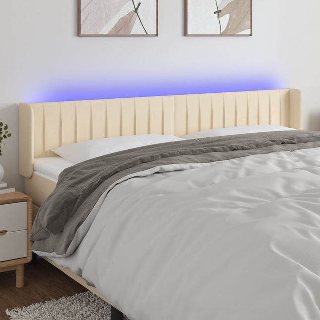sengegavl med LED-lys 163x16x78/88 cm stof cremefarvet