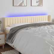 sengegavl med LED-lys 183x16x78/88 cm stof cremefarvet