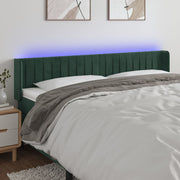 sengegavl med LED-lys 163x16x78/88 cm fløjl mørkegrøn