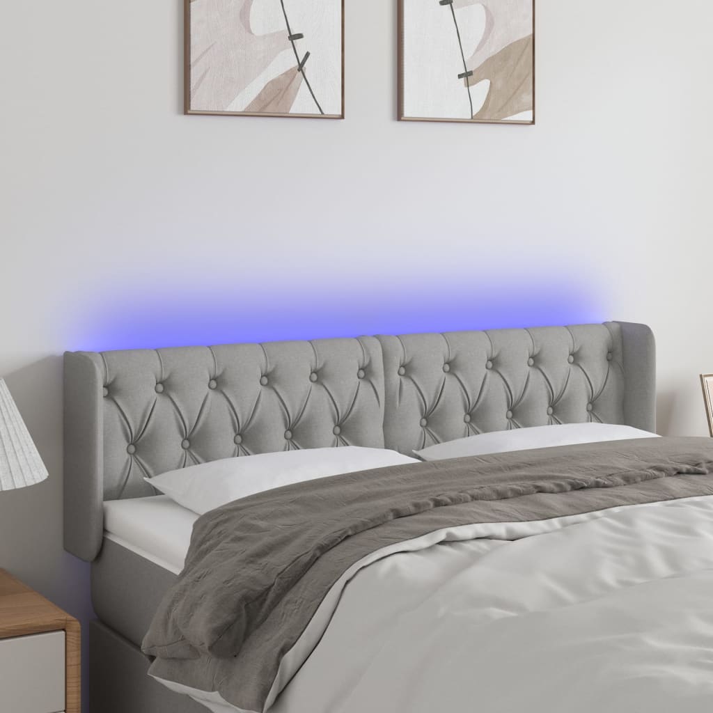 sengegavl med LED-lys 147x16x78/88 cm stof lysegrå