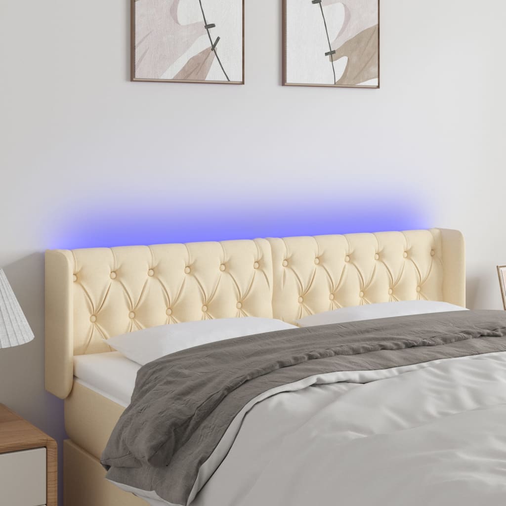 sengegavl med LED-lys 163x16x78/88 cm stof cremefarvet