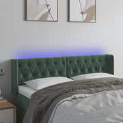 sengegavl med LED-lys 147x16x78/88 cm fløjl mørkegrøn