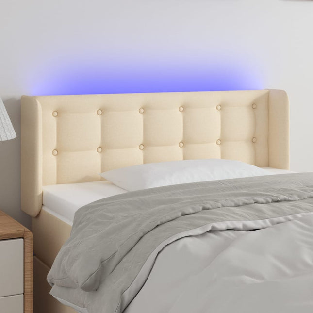 sengegavl med LED-lys 83x16x78/88 cm stof cremefarvet