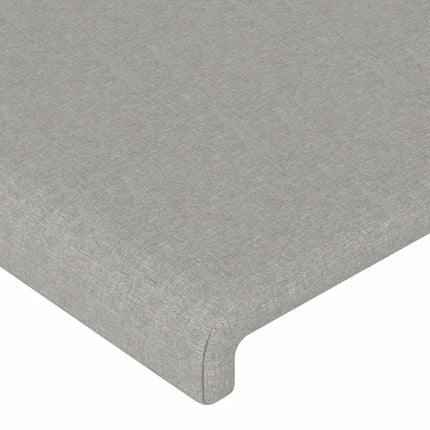 sengegavl med LED-lys 83x16x118/128 cm stof lysegrå