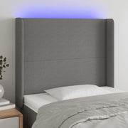 sengegavl med LED-lys 103x16x118/128 cm stof mørkegrå