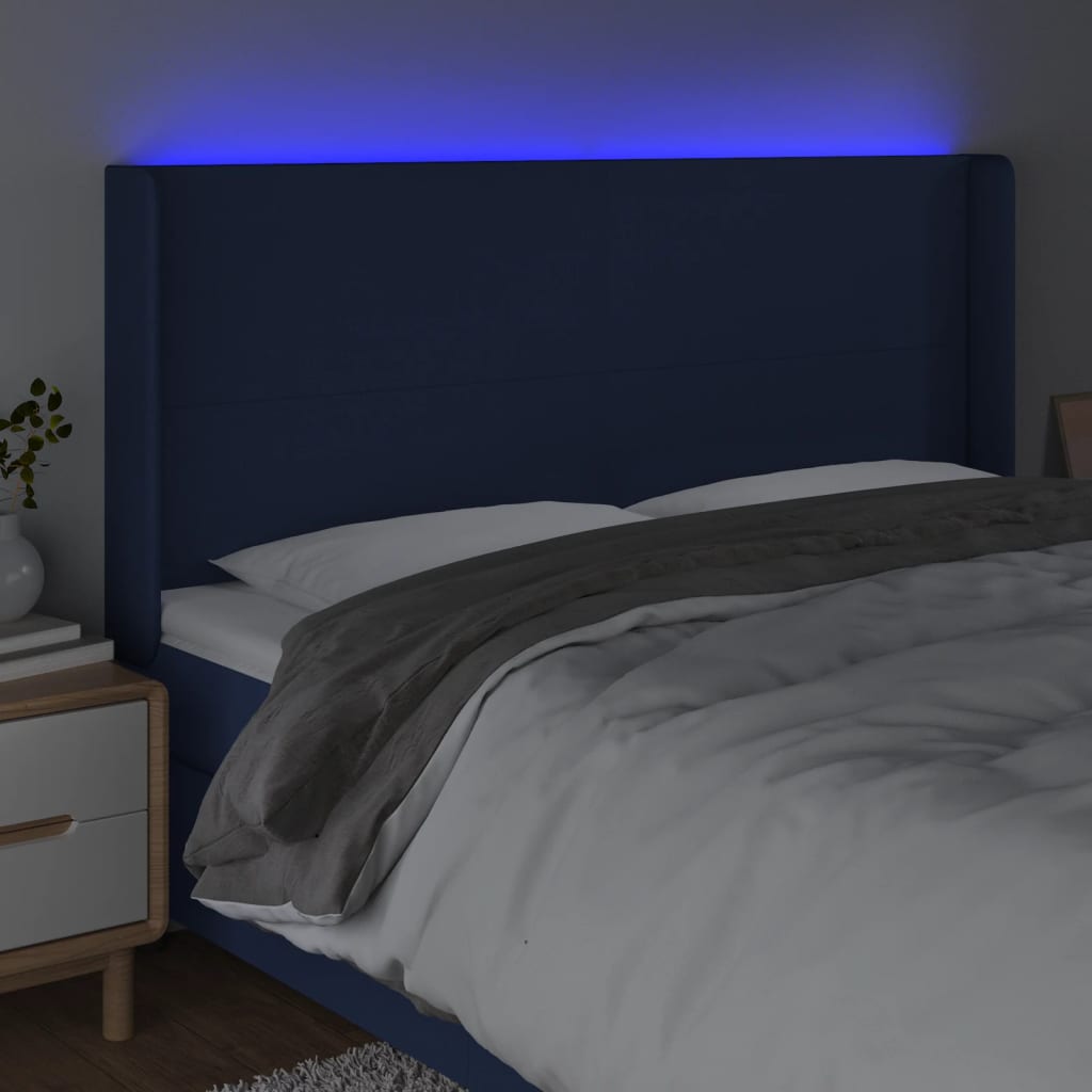 sengegavl med LED-lys 183x16x118/128 cm stof blå