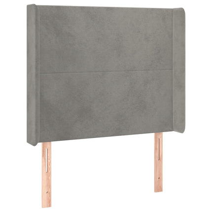 sengegavl med LED-lys 83x16x118/128 cm fløjl lysegrå