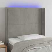 sengegavl med LED-lys 103x16x118/128 cm fløjl lysegrå