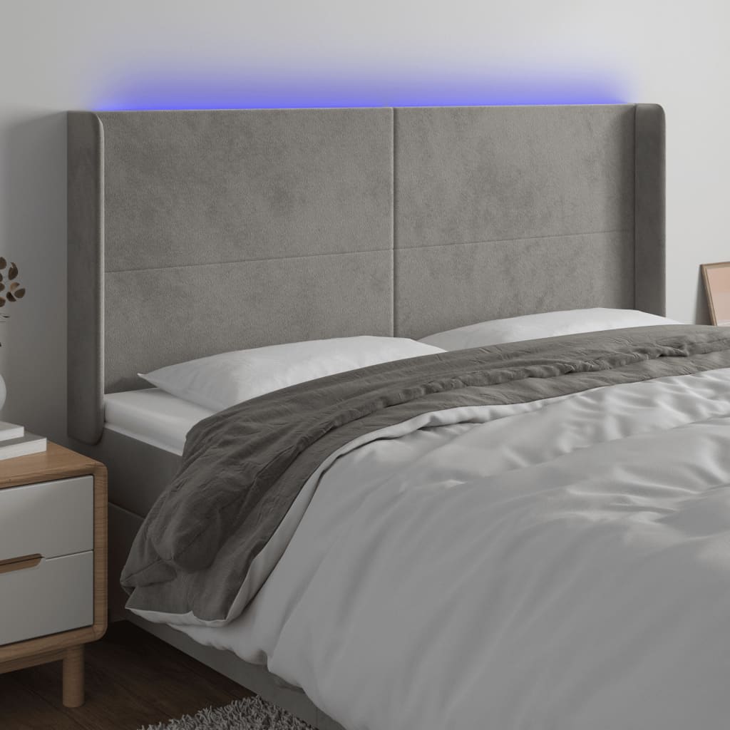 sengegavl med LED-lys 163x16x118/128 cm fløjl lysegrå