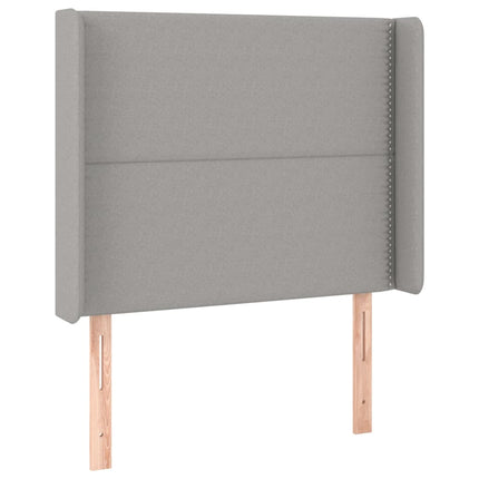 sengegavl med LED-lys 93x16x118/128 cm stof lysegrå
