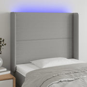 sengegavl med LED-lys 93x16x118/128 cm stof lysegrå