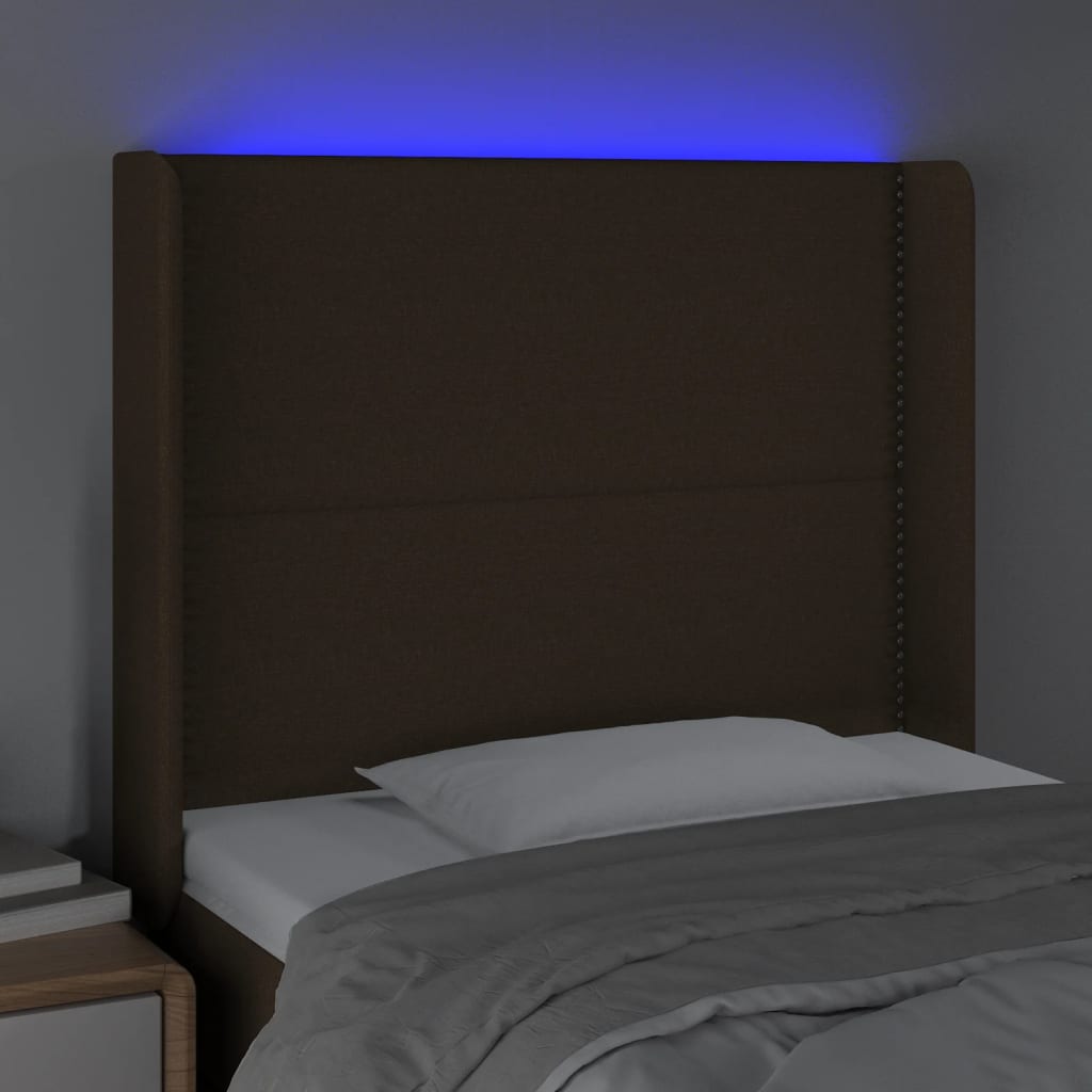sengegavl med LED-lys 103x16x118/128 cm stof mørkebrun