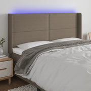 sengegavl med LED-lys 183x16x118/128 cm stof gråbrun