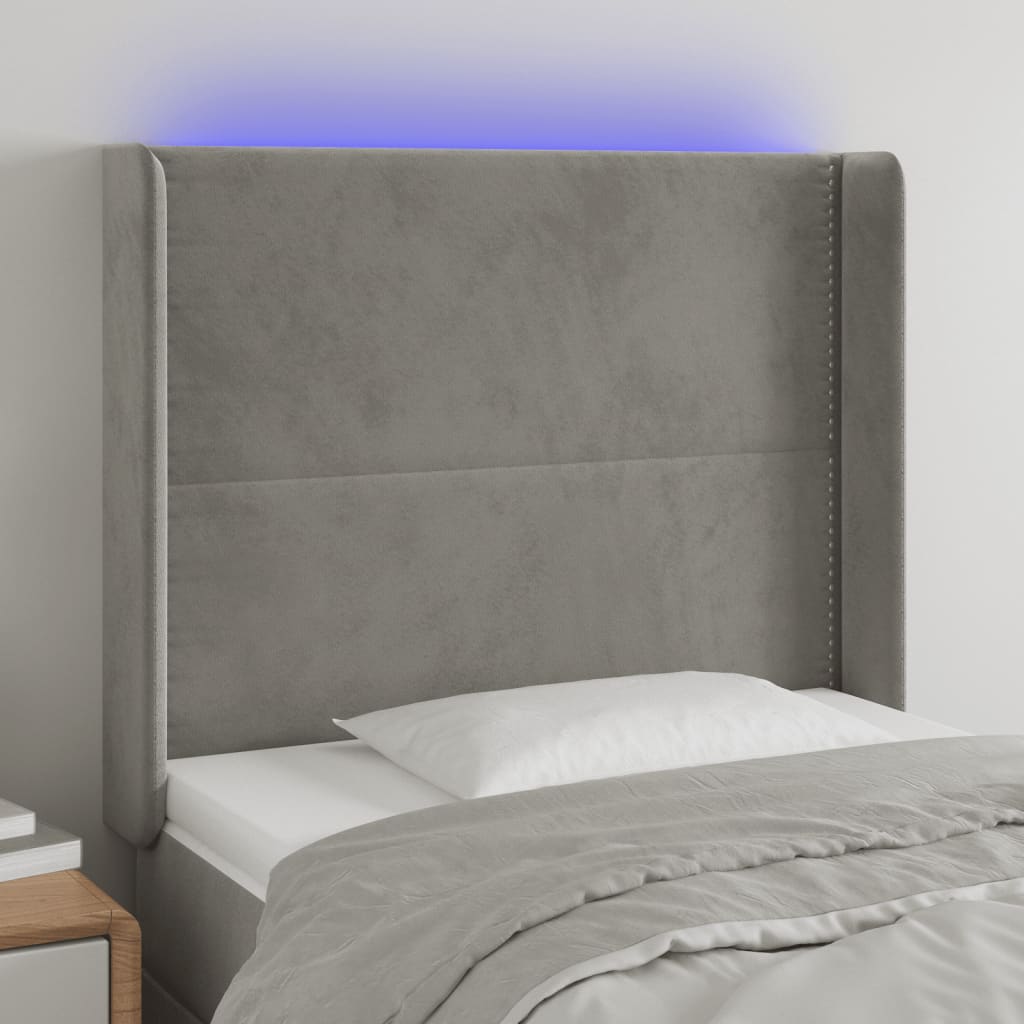 sengegavl med LED-lys 103x16x118/128 cm fløjl lysegrå