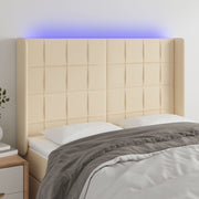 sengegavl med LED-lys 147x16x118/128 cm stof cremefarvet