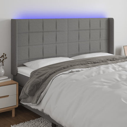sengegavl med LED-lys 163x16x118/128 cm stof mørkegrå