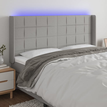 sengegavl med LED-lys 183x16x118/128 cm stof lysegrå
