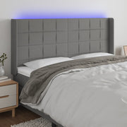 sengegavl med LED-lys 203x16x118/128 cm stof mørkegrå