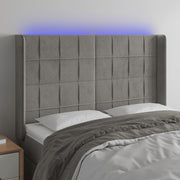 sengegavl med LED-lys 147x16x118/128 cm fløjl lysegrå