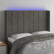 sengegavl med LED-lys 147x16x118/128 cm fløjl mørkegrå