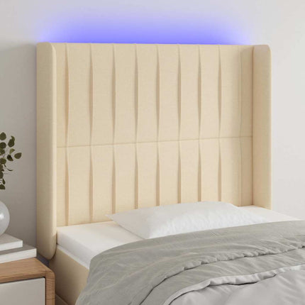 sengegavl med LED-lys 83x16x118/128 cm stof cremefarvet