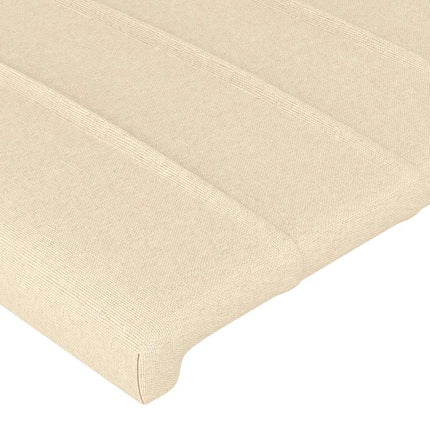 sengegavl med LED-lys 93x16x118/128 cm stof cremefarvet