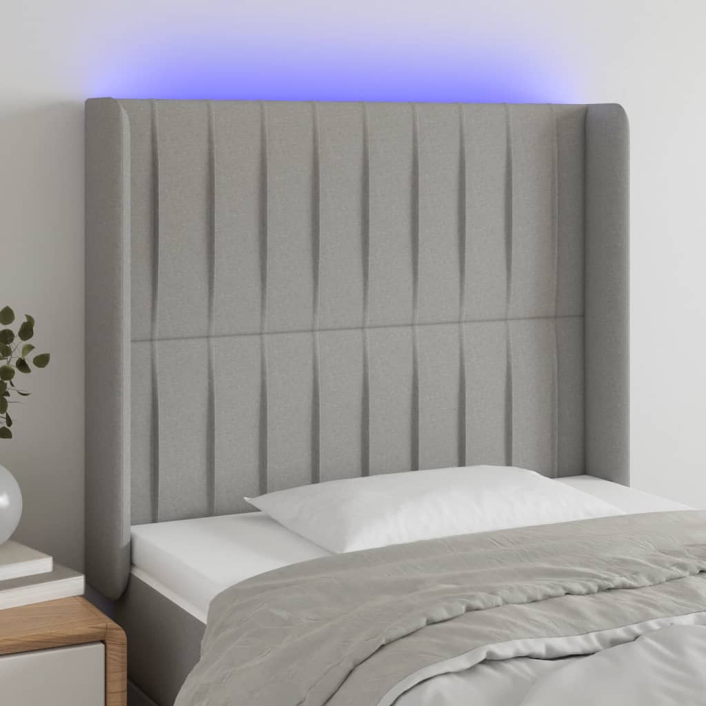 sengegavl med LED-lys 103x16x118/128 cm stof lysegrå