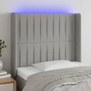 sengegavl med LED-lys 103x16x118/128 cm stof lysegrå