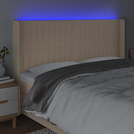 sengegavl med LED-lys 163x16x118/128 cm stof cremefarvet