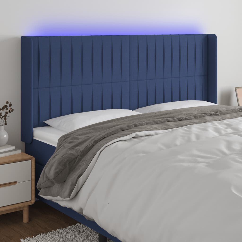 sengegavl med LED-lys 183x16x118/128 cm stof blå