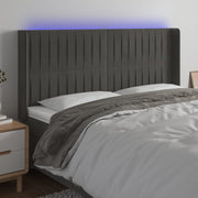 sengegavl med LED-lys 163x16x118/128 cm fløjl mørkegrå