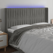 sengegavl med LED-lys 183x16x118/128 cm fløjl lysegrå
