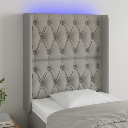 sengegavl med LED-lys 83x16x118/128 cm stof lysegrå
