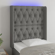 sengegavl med LED-lys 83x16x118/128 cm stof mørkegrå
