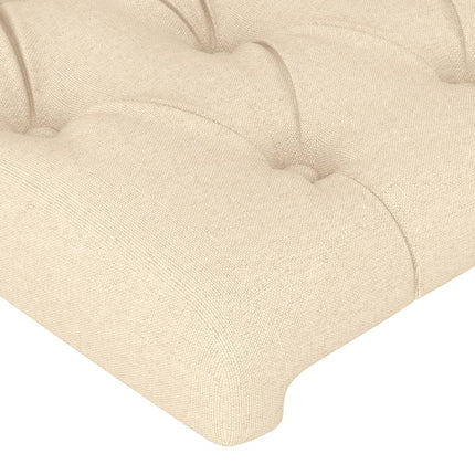 sengegavl med LED-lys 147x16x118/128 cm stof cremefarvet
