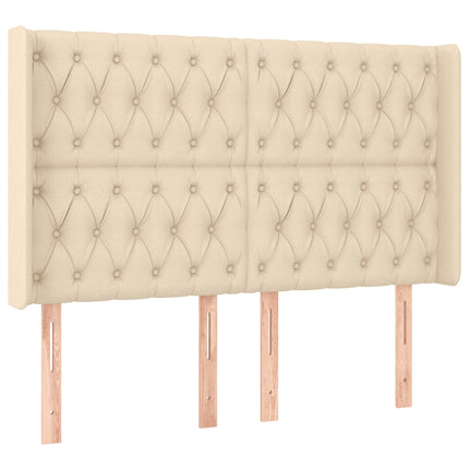 sengegavl med LED-lys 163x16x118/128 cm stof cremefarvet