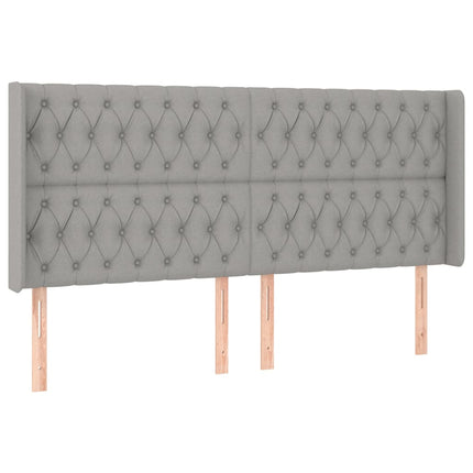 sengegavl med LED-lys 183x16x118/128 cm stof lysegrå