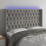 sengegavl med LED-lys 163x16x118/128 cm fløjl lysegrå