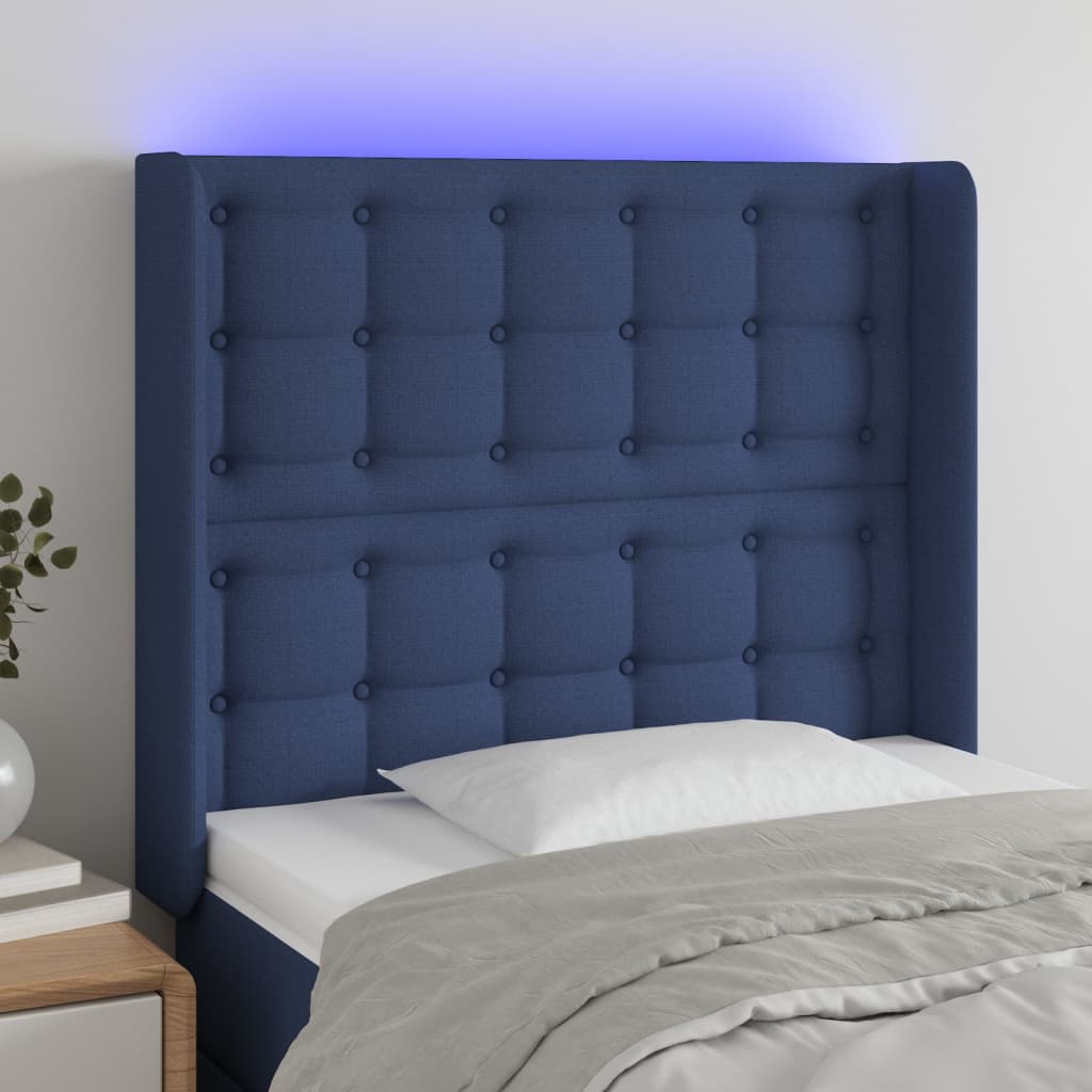sengegavl med LED-lys 83x16x118/128 cm stof blå
