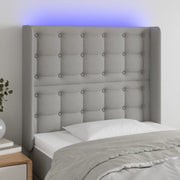 sengegavl med LED-lys 93x16x118/128 cm stof lysegrå