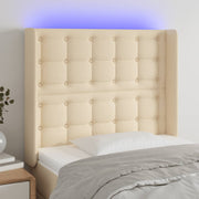 sengegavl med LED-lys 93x16x118/128 cm stof cremefarvet