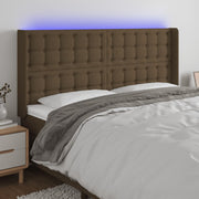 sengegavl med LED-lys 163x16x118/128 cm stof mørkebrun