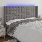 sengegavl med LED-lys 183x16x118/128 cm stof mørkegrå