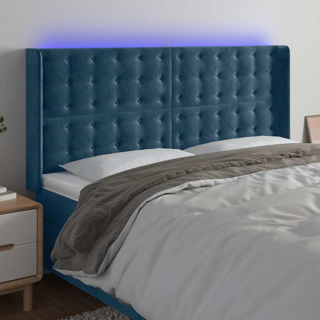 sengegavl med LED-lys 163x16x118/128 cm fløjl mørkeblå